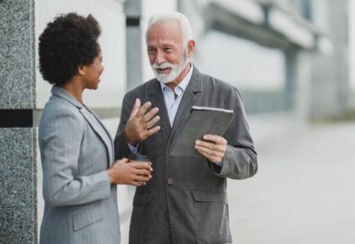 An older gentleman engaging in a conversation