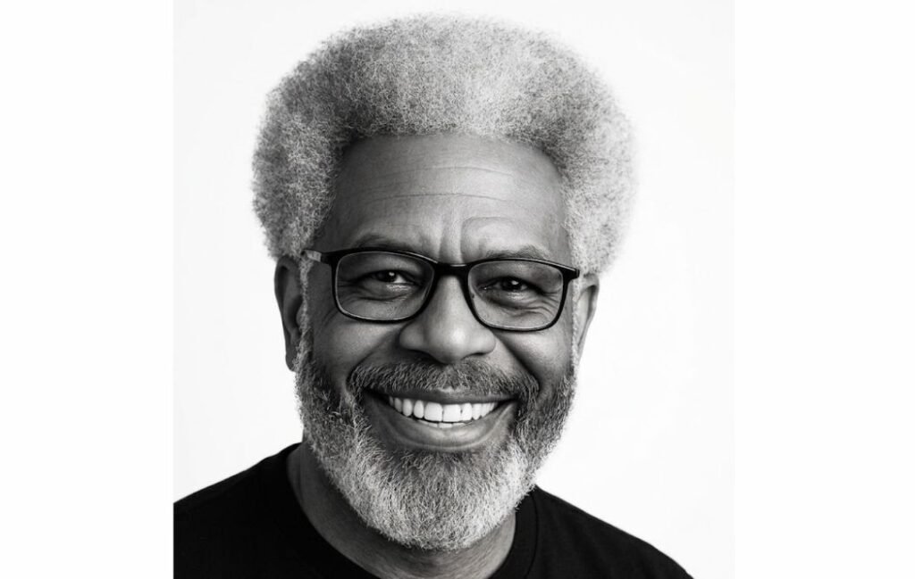 An old black man with the silver fox afro haistyle