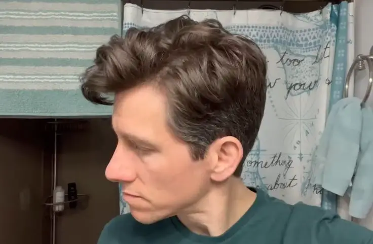 A man wearing the side part hairstyle