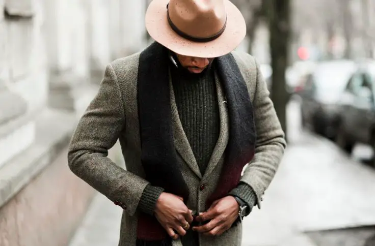 A man layers his blazer for the winter