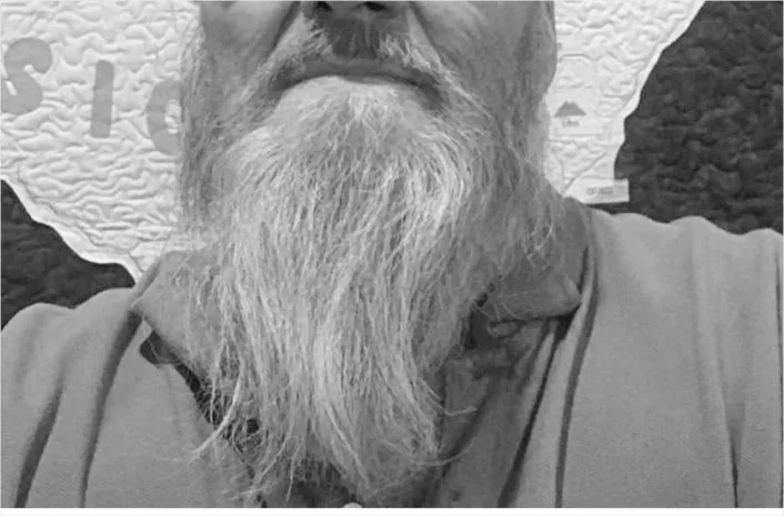 A man wearing the biker long goatee