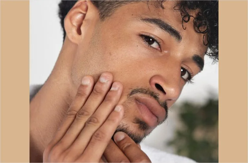 A man showing his men's skin issue