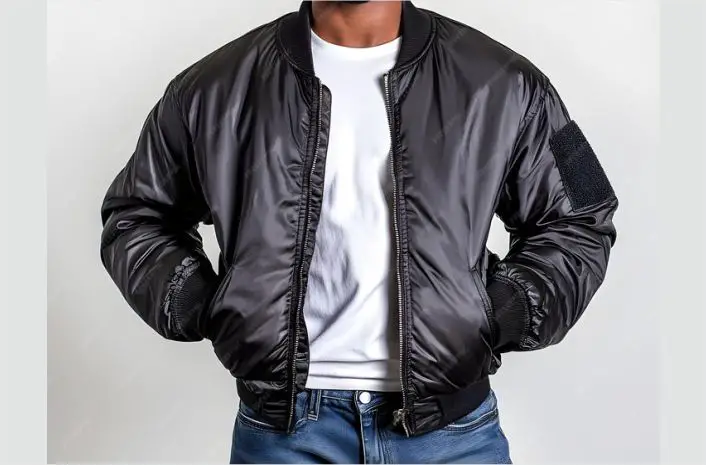 A man wearing black bomber jacket