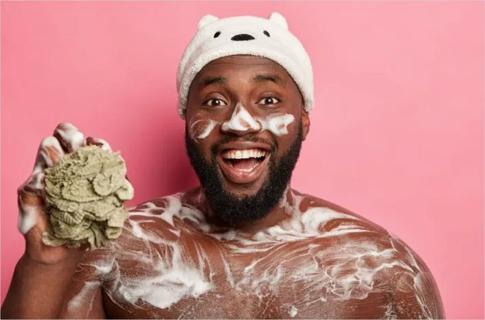 A man attending to his skin