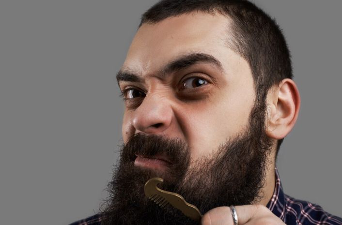 A man showing off his facial hair and beard
