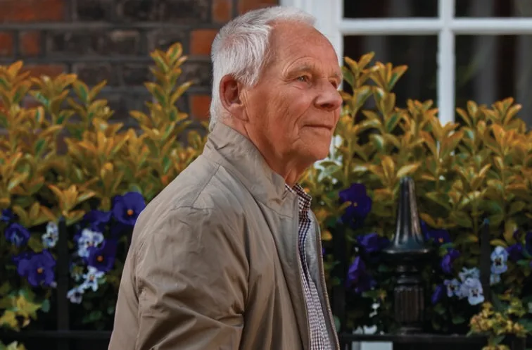 An older man taking a walk