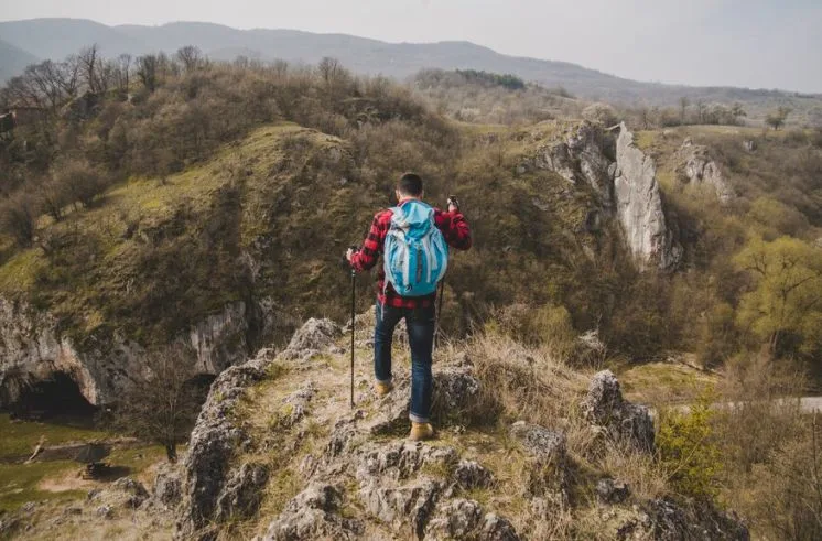 A 30s man hiking for hobby