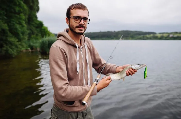 A man engaging in fishing, outdoor hobbies