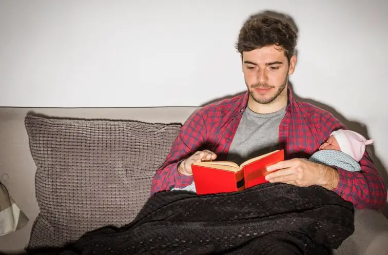 A man reading as hobby at home.