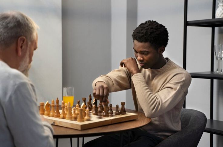 A man of 20s playing chess