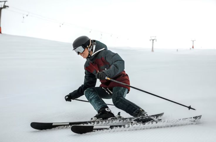 Skiing young man