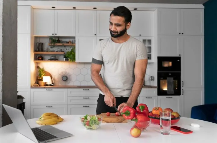 A man doing social hobby, cooking