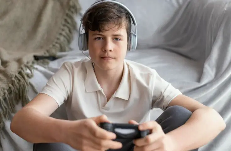 A young man playing video game