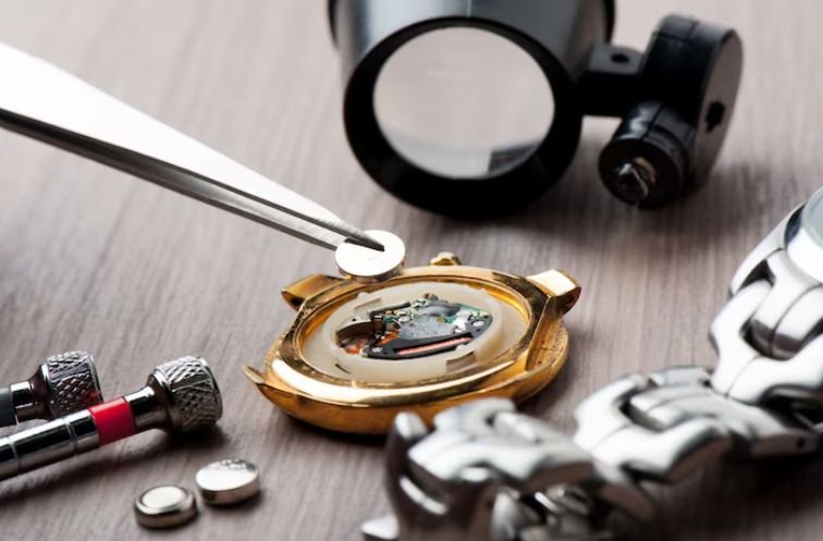 Signs It’s Time to Service Your Watch = A man servicing a watch