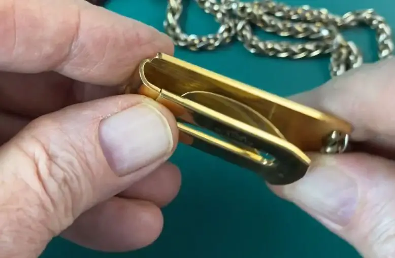 A pocket watch clip or bar