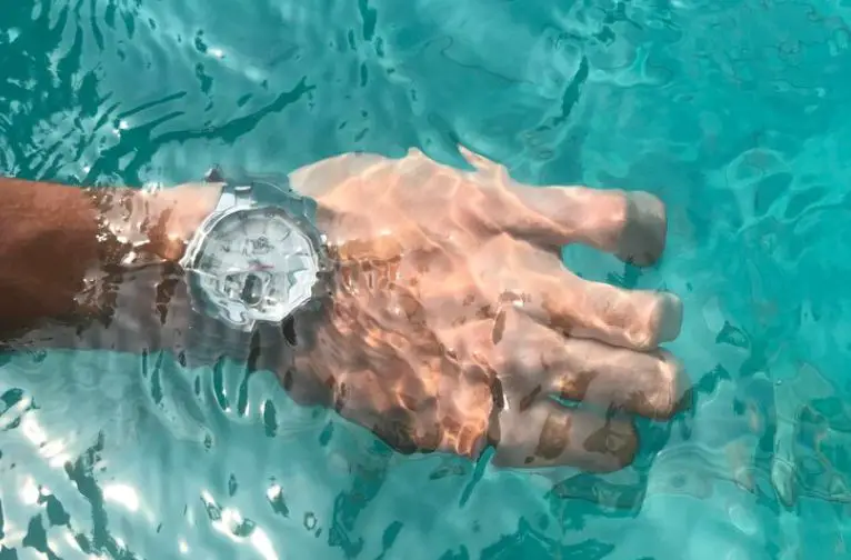 A man wearing water resistant watch and sweilling