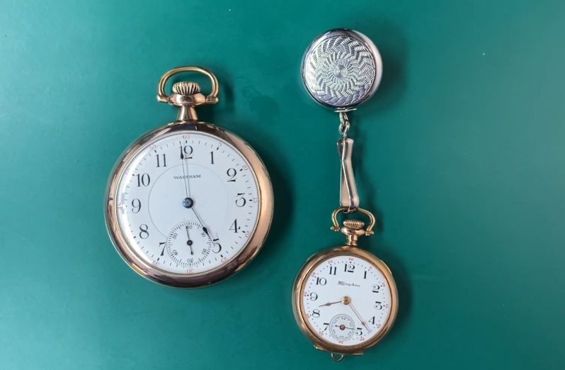 A pocket watch and fob