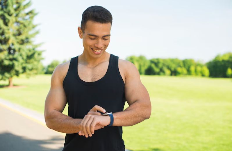 A man using a smartwatch to track his workout