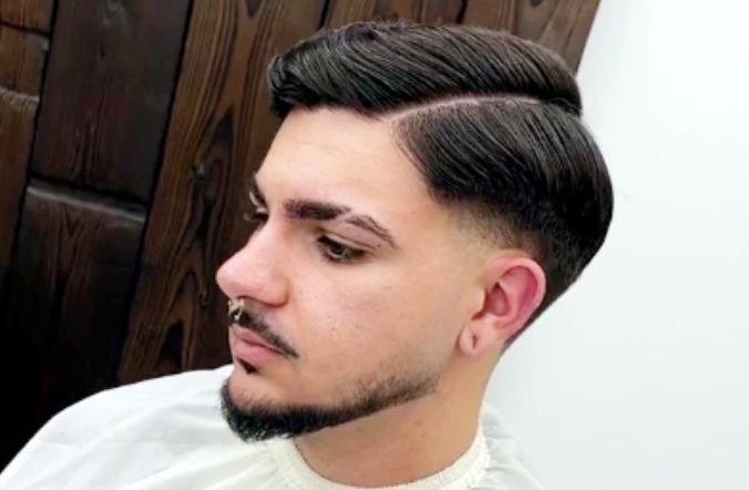 A typical side part with taper fade hairstyle