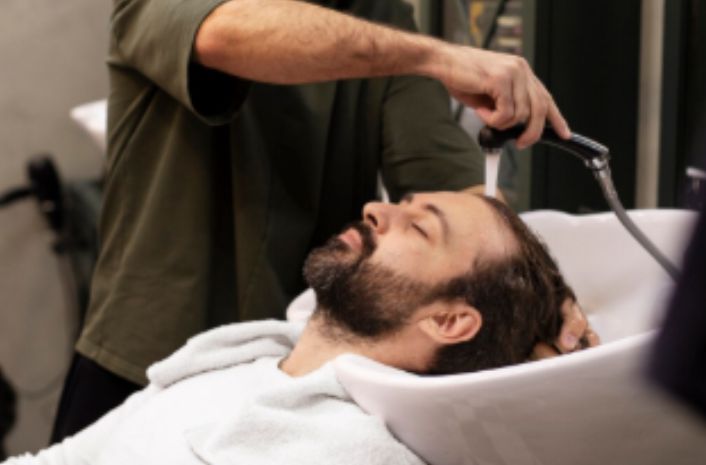 A man getting a hair styling