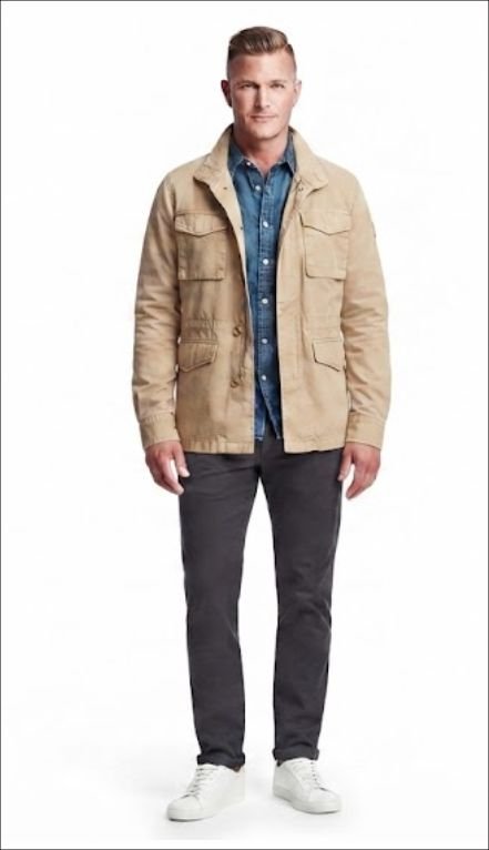 A man in Denim Shirt Layered Under a Field Jacket