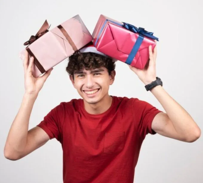 Gifts for Teen Boys - a teen boy excited to receive his gifts
