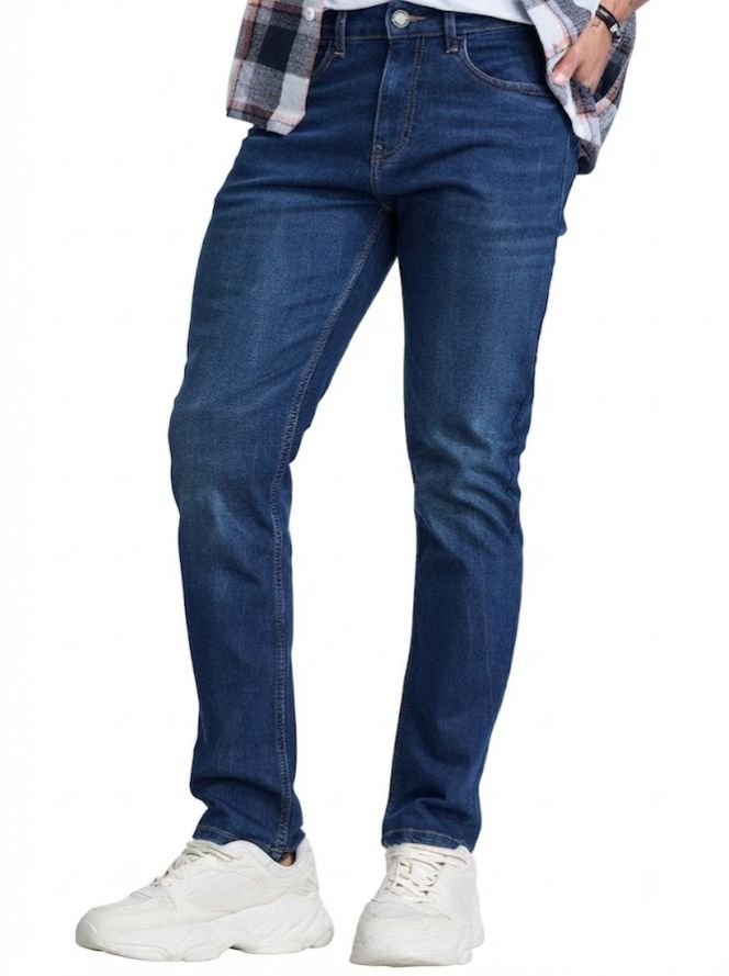 A man in a men's Tapered Fit jeans