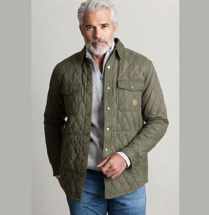 An older man in a Quilted or Waxed Field Jacket Over a Shirt and Denim