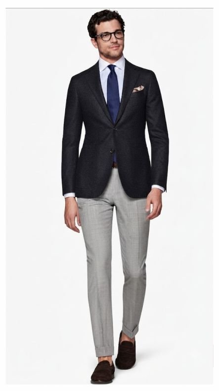 A man in a men's business casual outfit of Charcoal Blazer, White Shirt, and Navy Tie