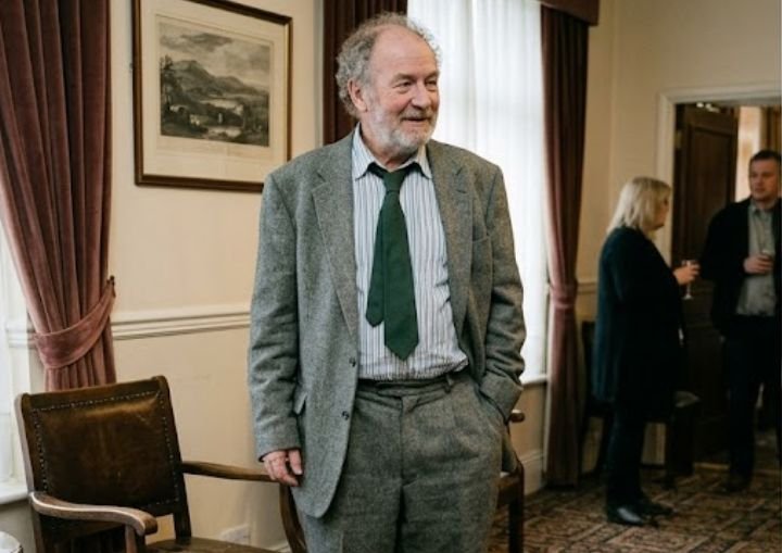 Older man in an ill-fitting suit