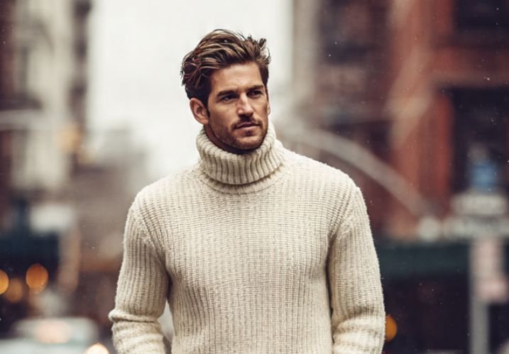 A man in a turtleneck knitwear