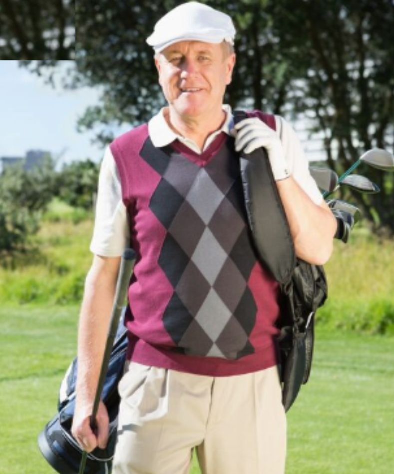 An old man in a layered golf outfit