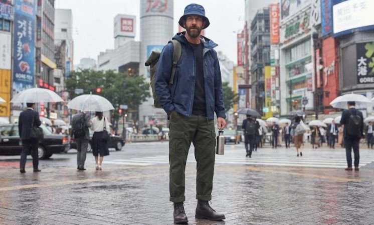 Rain Shell, Bucket Hat, And Cargo Pants outfit by a man