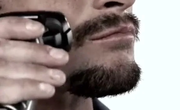 A man trimming his Balbo beard