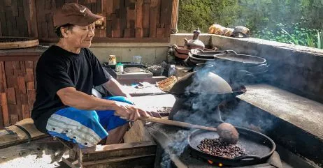 An older man cooking as a hobby