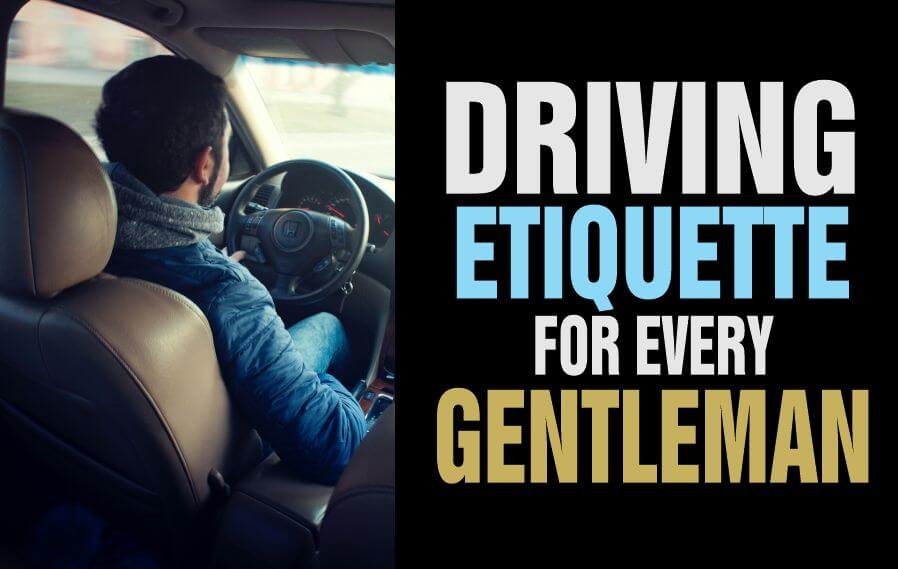 A man observing driving etiquette behind the wheel
