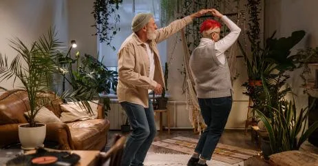 An elderly man dancing