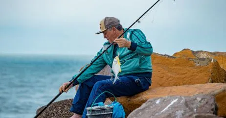 An older gentleman fishing as one of the hobbies for older gentlemen