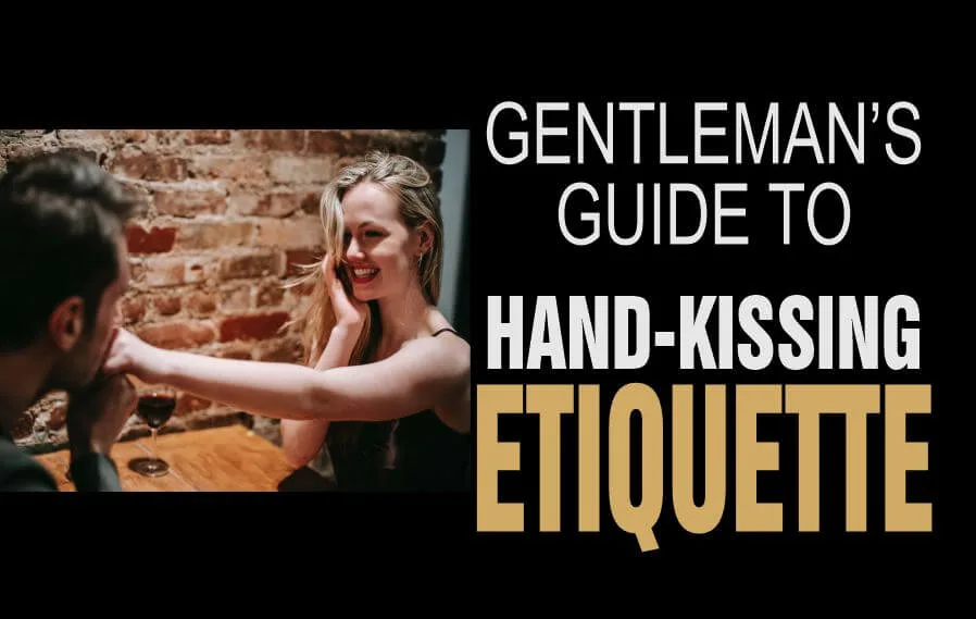 A young man kissing the hand of a lady in a demonstration of hand-kissing etiquette