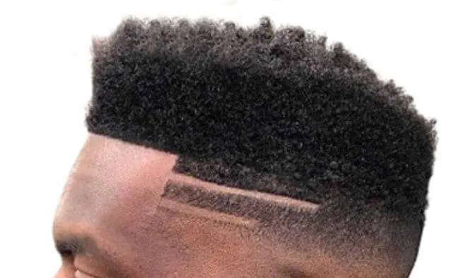 The high top fade with hard part haircut