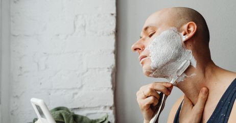 A man taking care of beards with shaving powder
