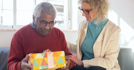 A senior man receiving a good gift